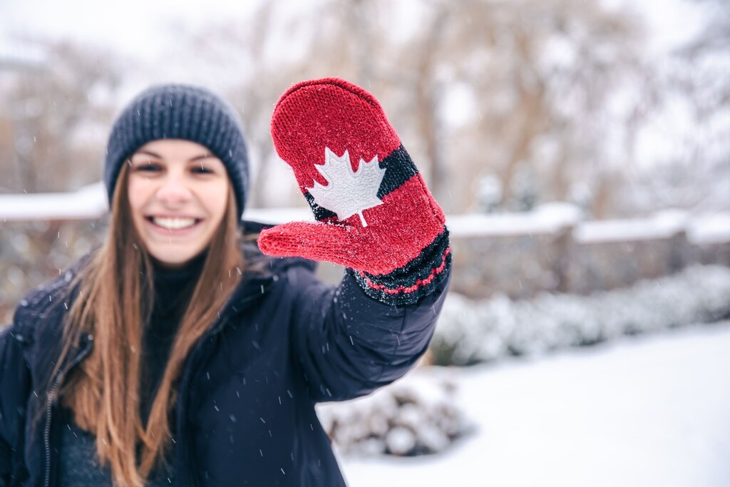 mulher com roupas de frio representando o inglês canadense